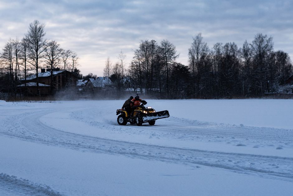 Snow plow clearing a rural driveway in Ontario winter
